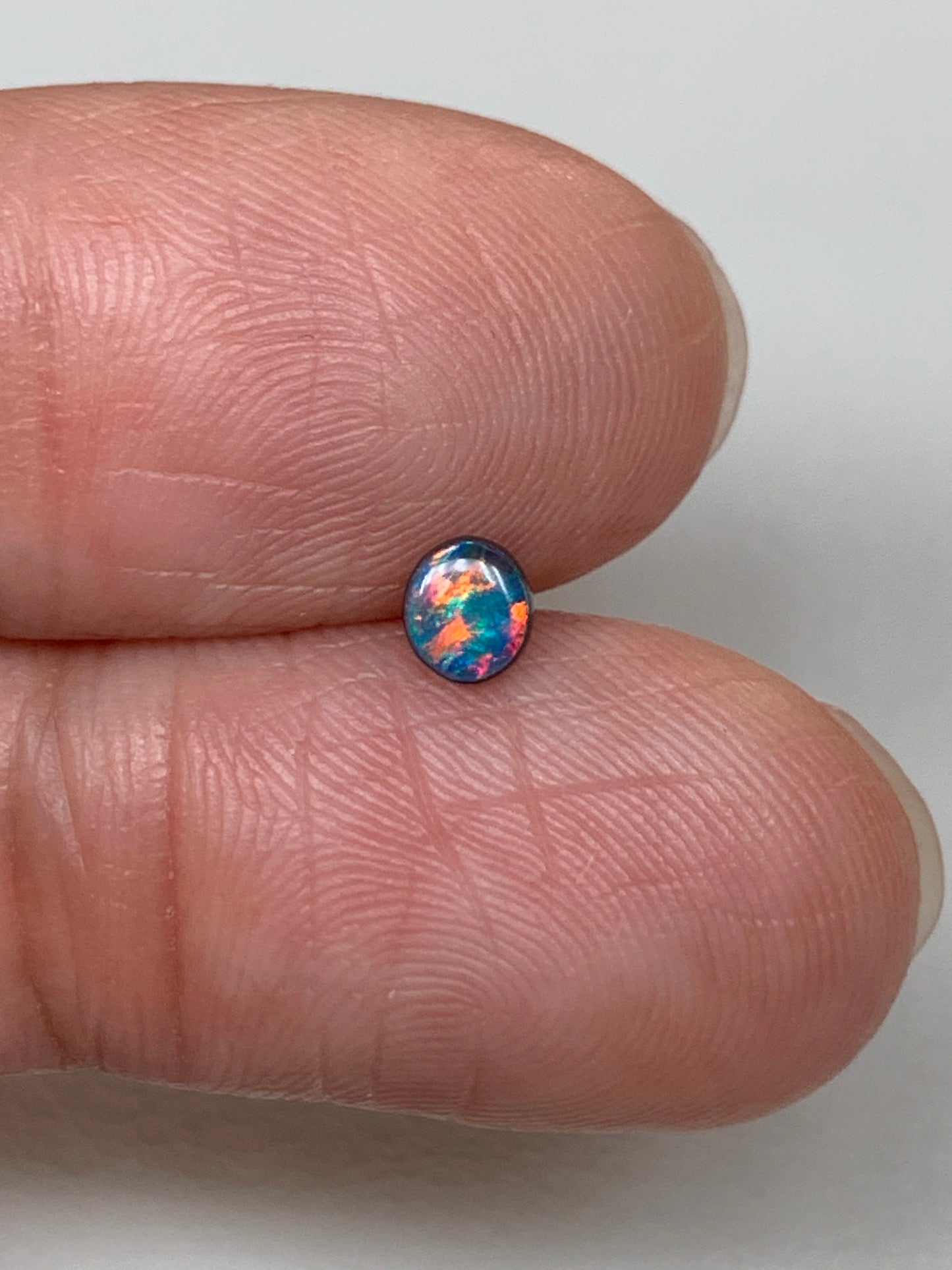 Red Head Cutie. Lightning Ridge Doublet Black Opal. 0.19 Ct