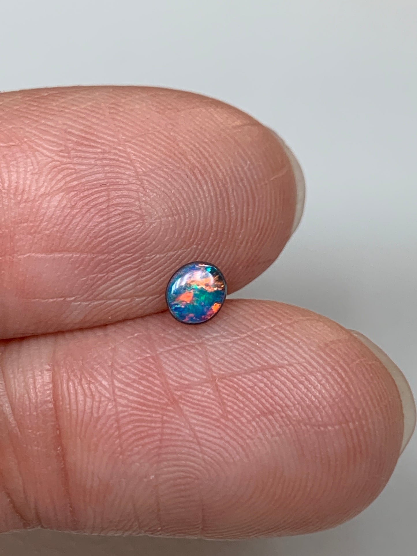 Red Head Cutie. Lightning Ridge Doublet Black Opal. 0.19 Ct