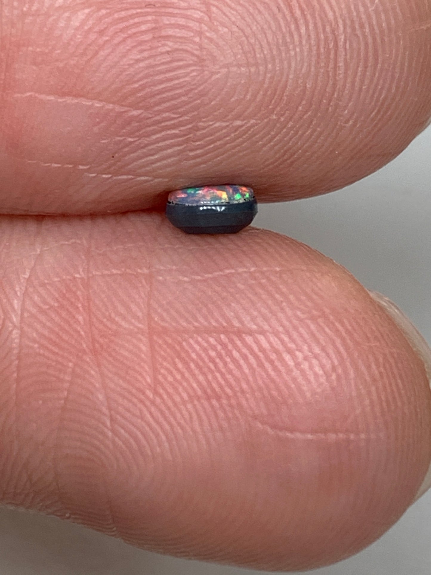 Red Head Cutie. Lightning Ridge Doublet Black Opal. 0.19 Ct