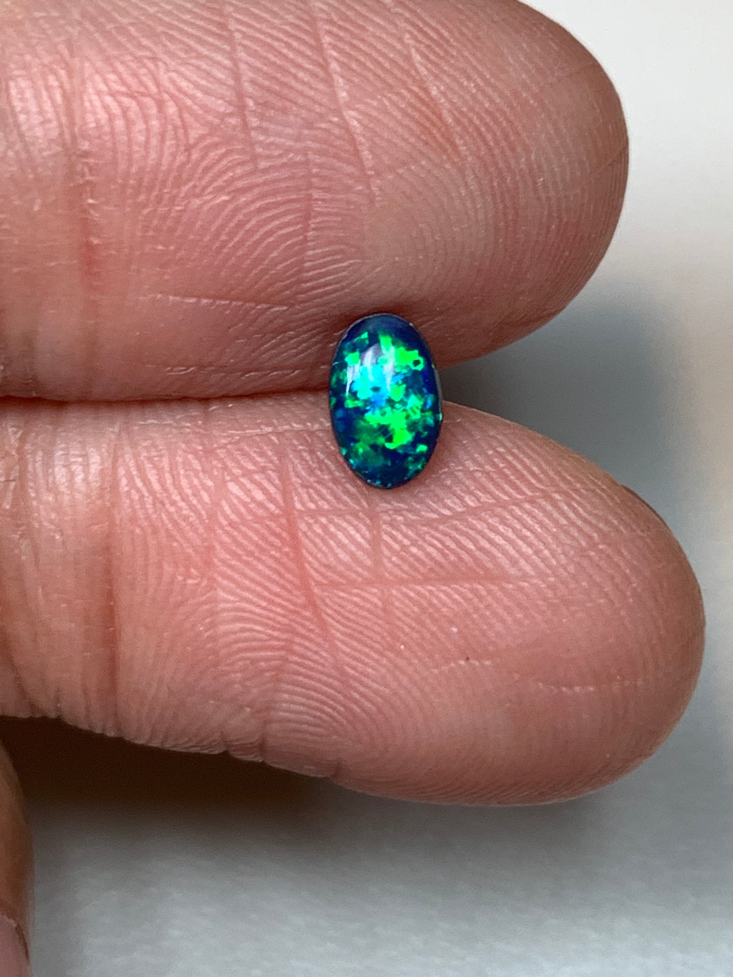 Green Sparkles. Lightning Ridge Doublet Black Opal. 0.31 Ct