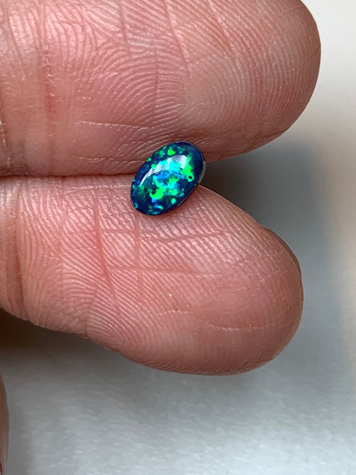 Green Sparkles. Lightning Ridge Doublet Black Opal. 0.31 Ct
