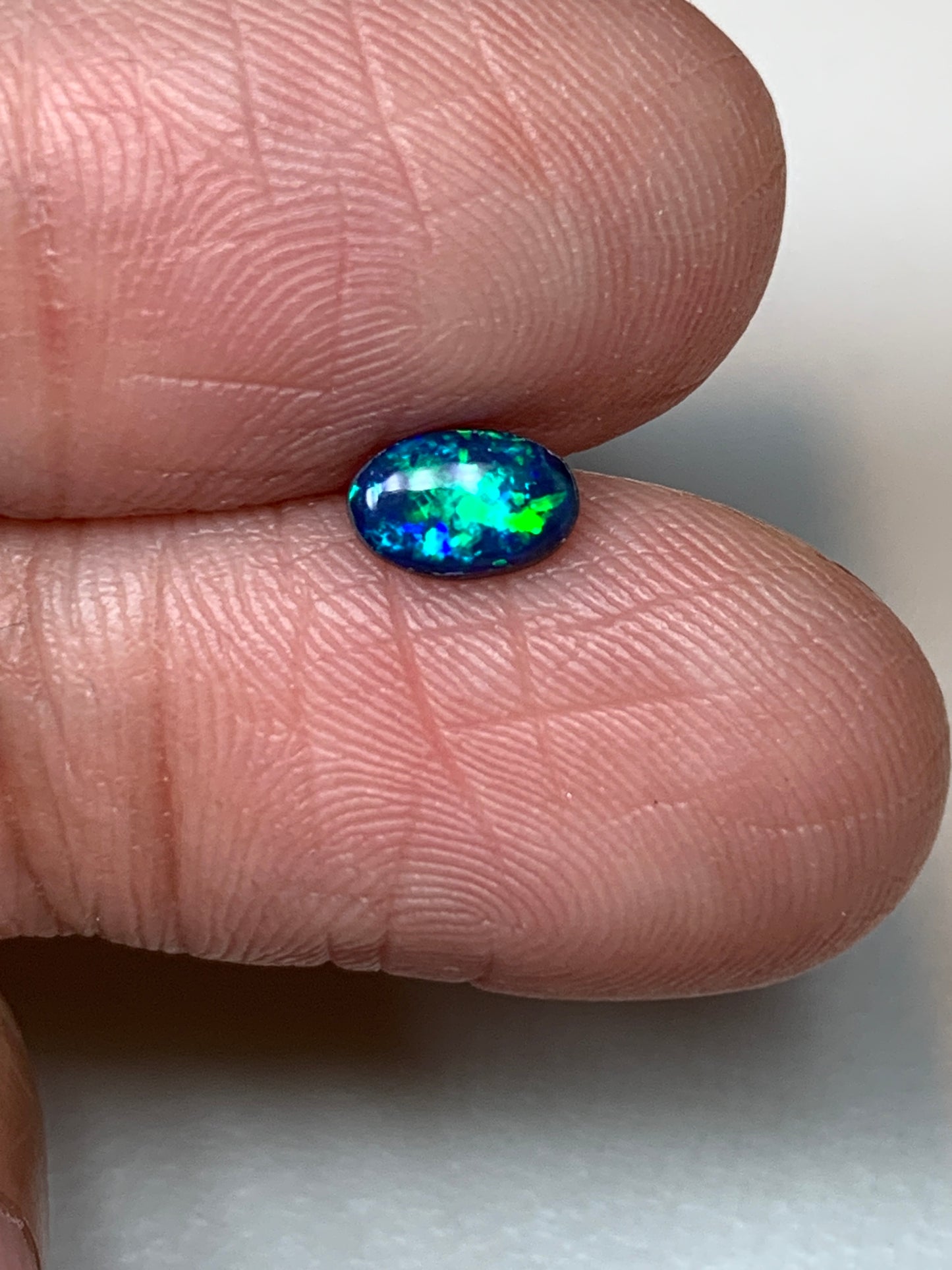 Green Sparkles. Lightning Ridge Doublet Black Opal. 0.31 Ct