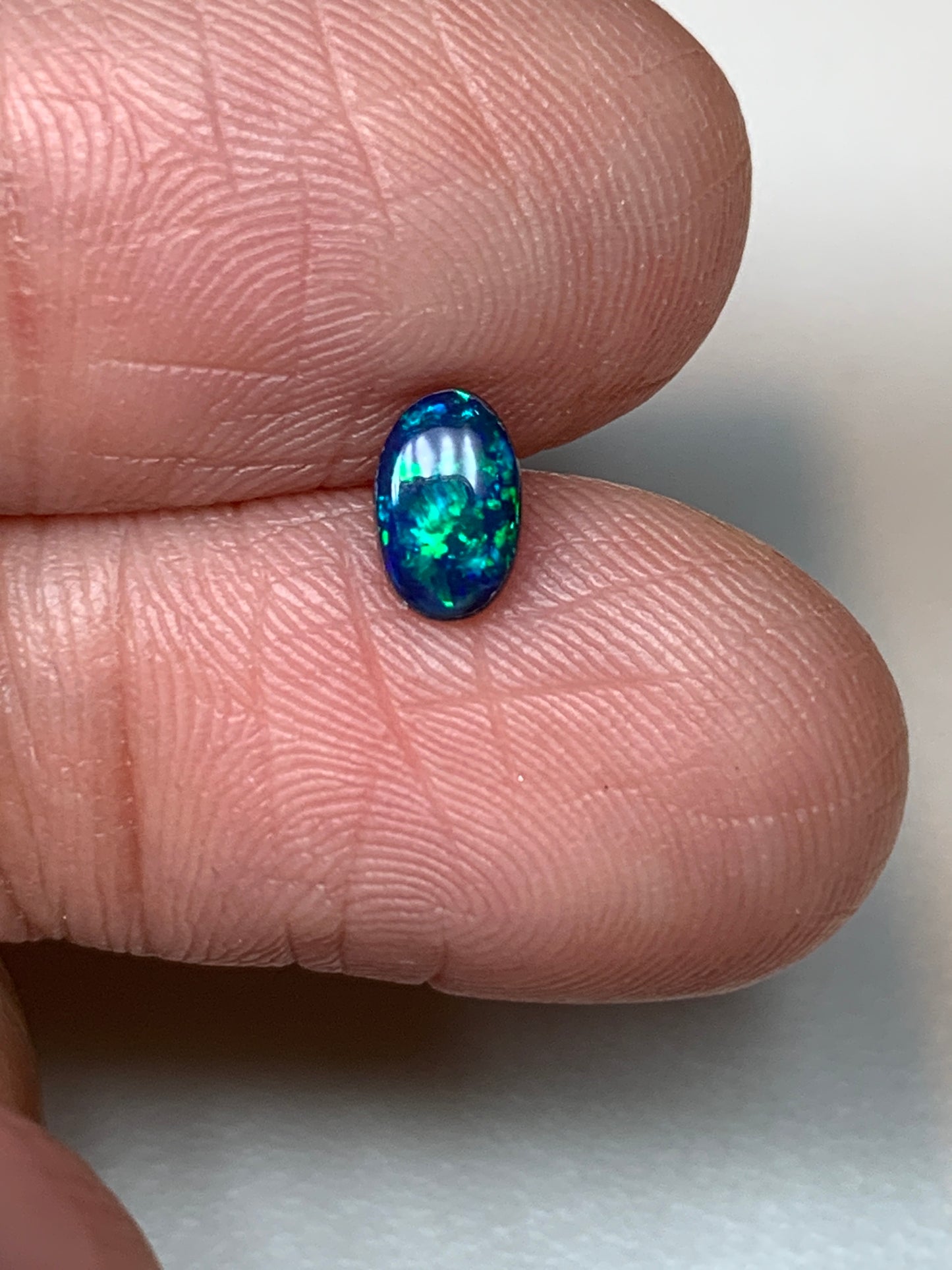 Green Sparkles. Lightning Ridge Doublet Black Opal. 0.31 Ct