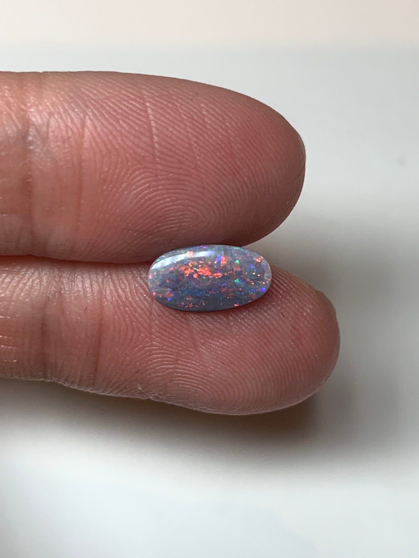 Red Stars. Lightning Ridge Semi- Black Opal. 0.67 Ct