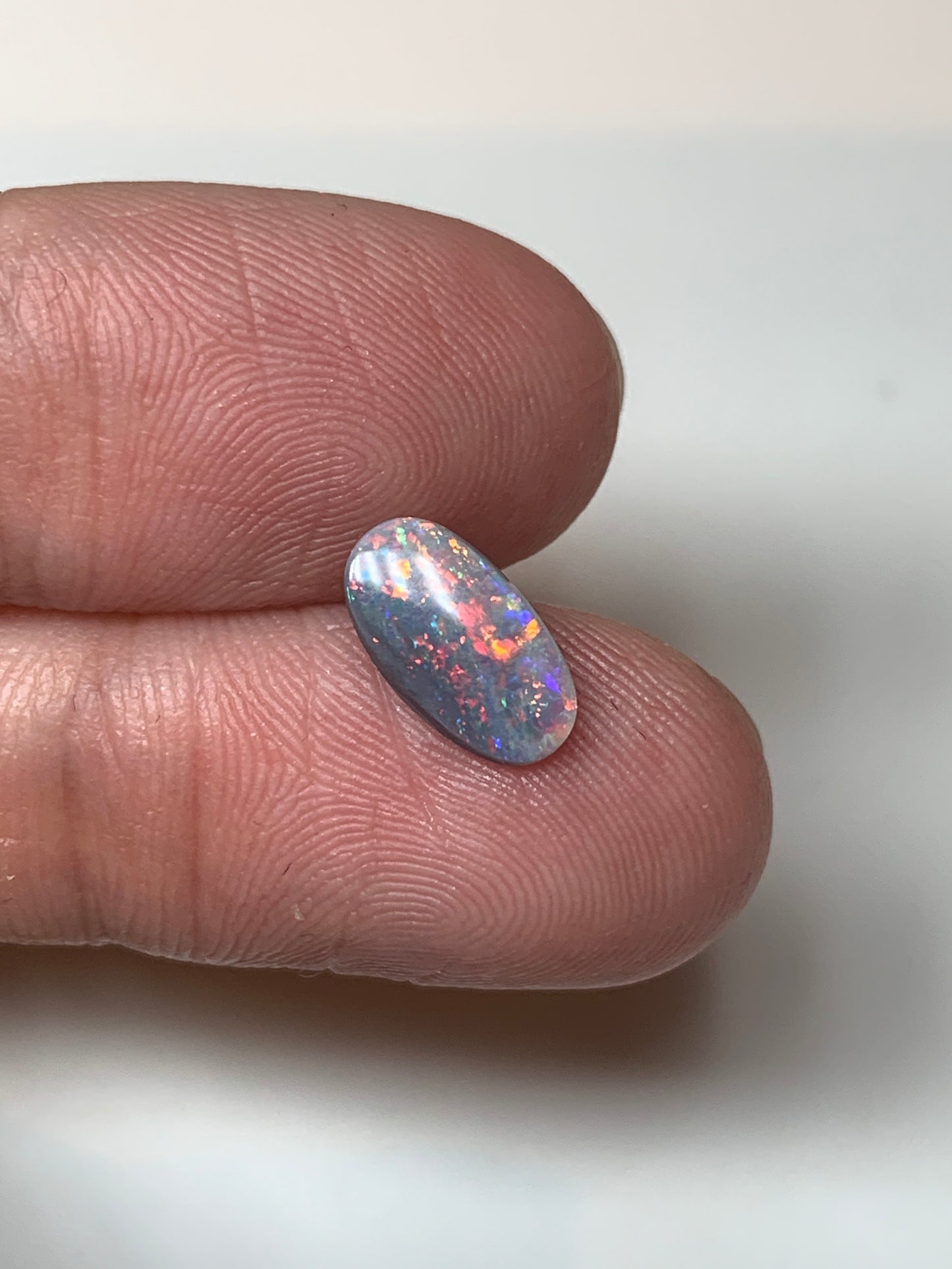 Red Stars. Lightning Ridge Semi- Black Opal. 0.67 Ct