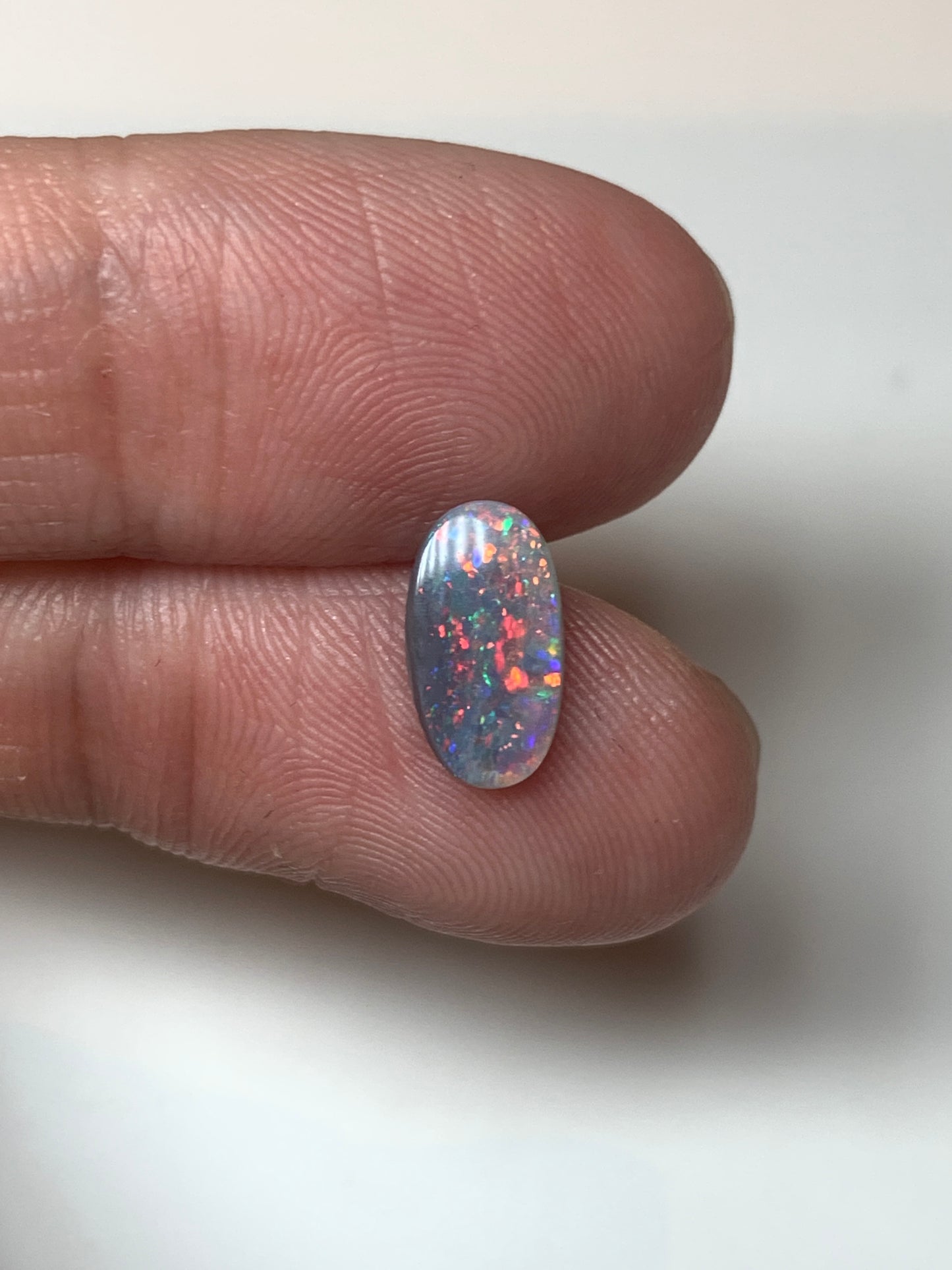 Red Stars. Lightning Ridge Semi- Black Opal. 0.67 Ct