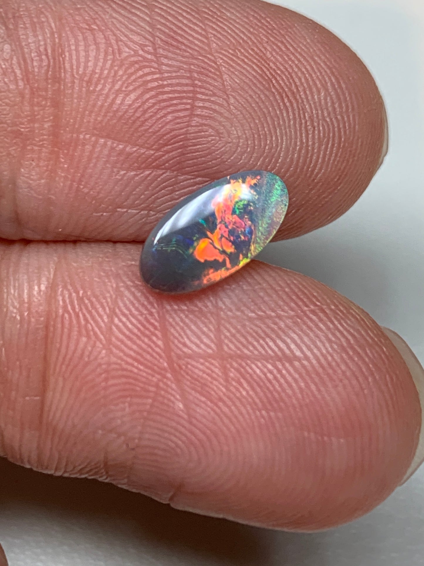 Red Fire. Lightning Ridge Solid Black Opal. 0.68 Ct