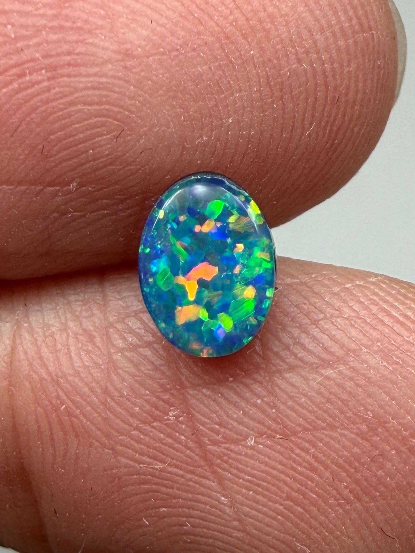 Glitter Glow. Lightning Ridge Doublet Black Opal. 0.54 Ct