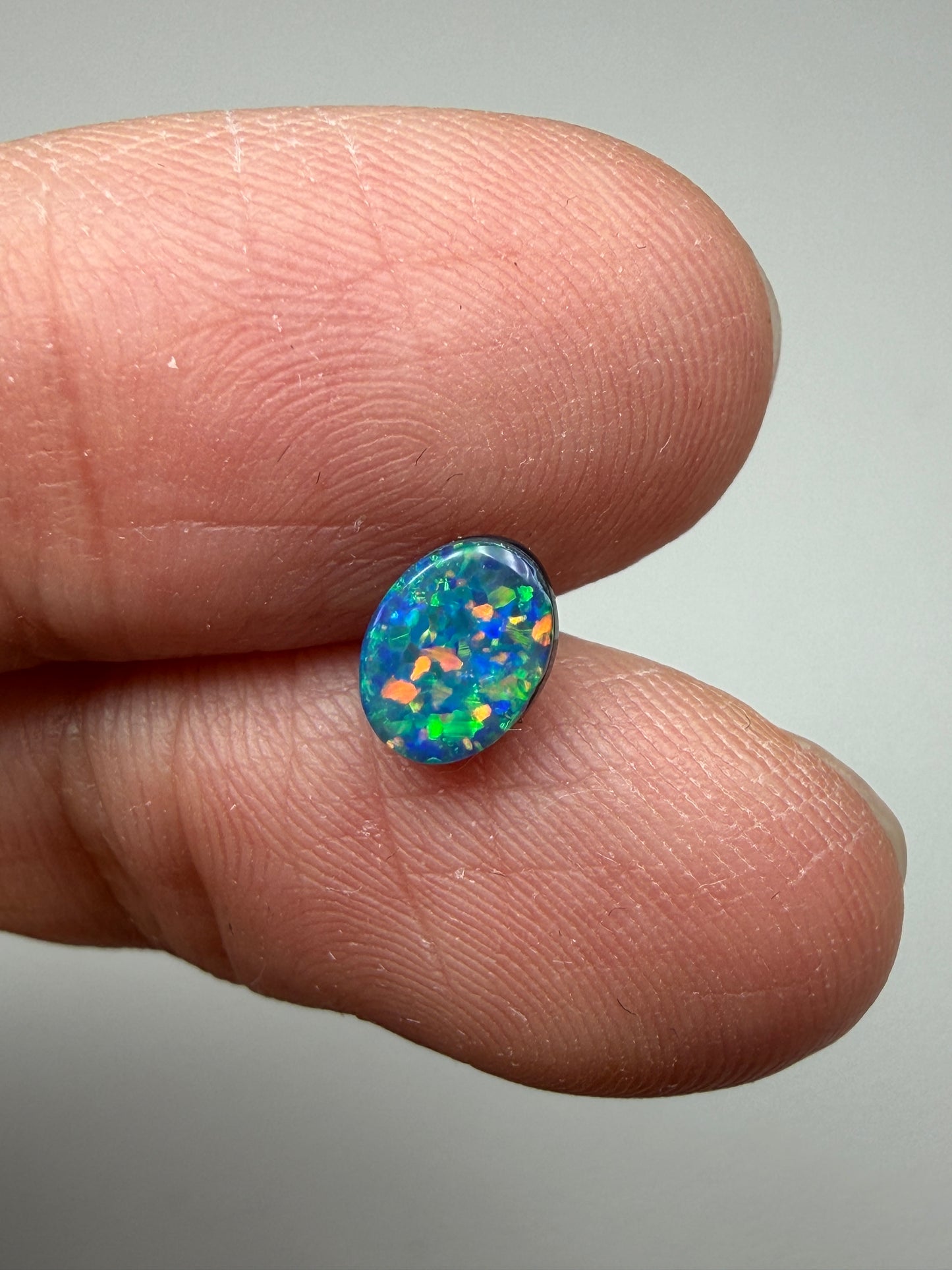 Glitter Glow. Lightning Ridge Doublet Black Opal. 0.54 Ct
