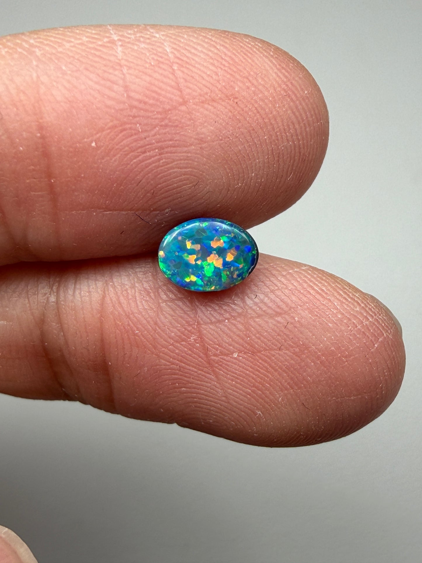 Glitter Glow. Lightning Ridge Doublet Black Opal. 0.54 Ct