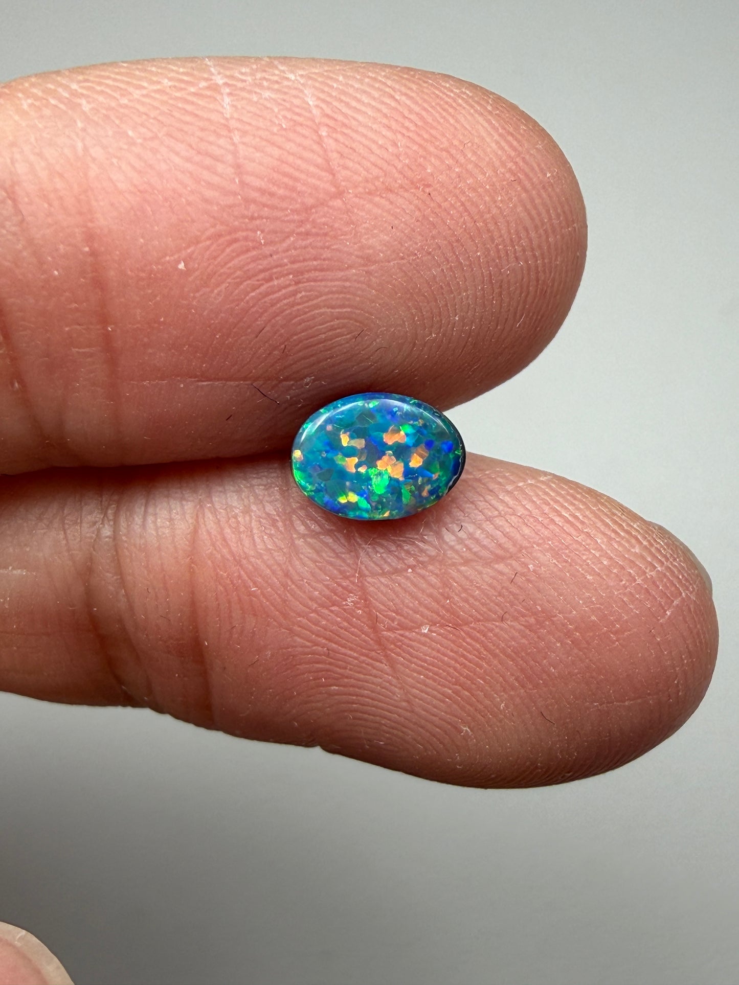 Glitter Glow. Lightning Ridge Doublet Black Opal. 0.54 Ct