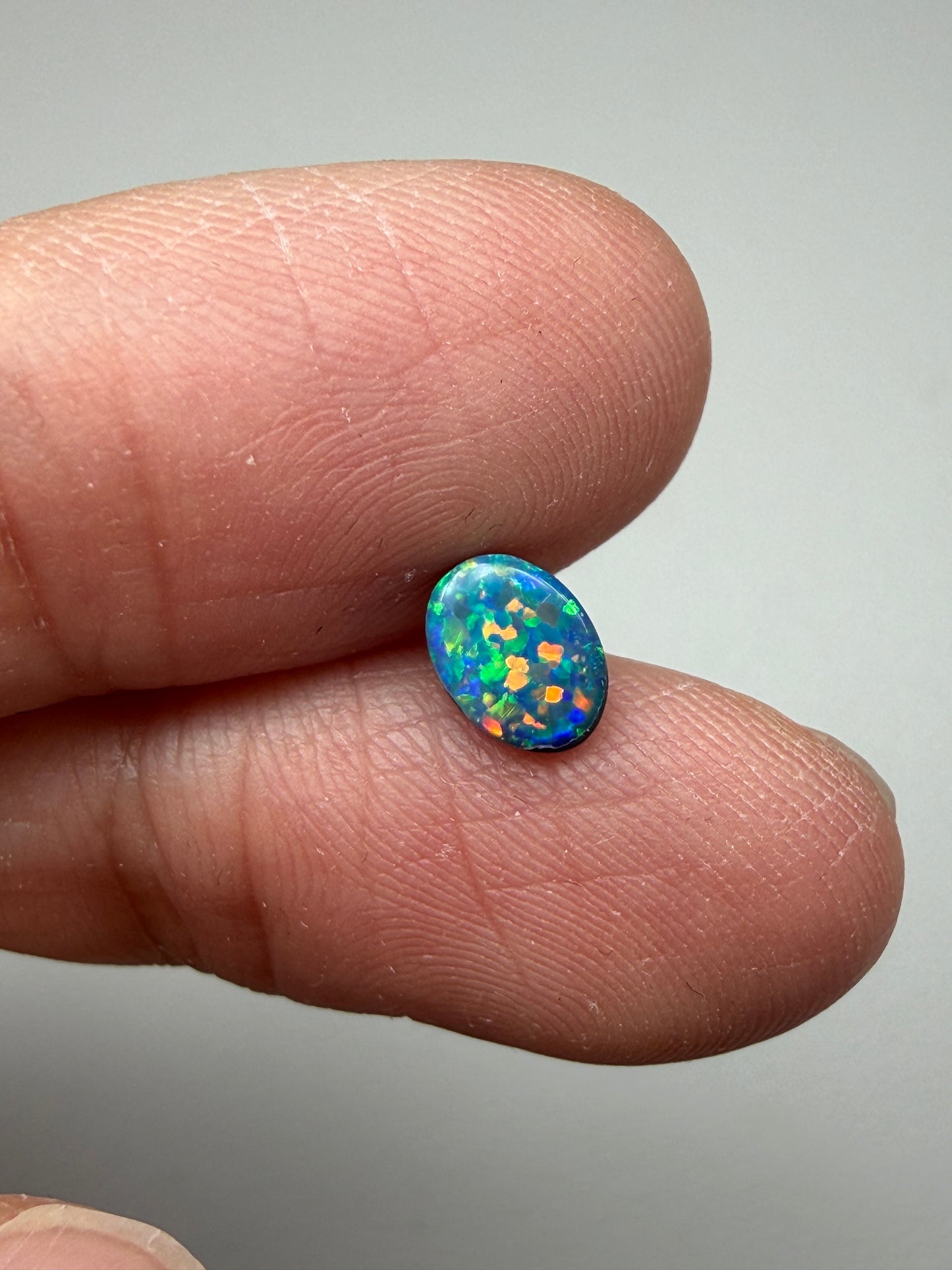 Glitter Glow. Lightning Ridge Doublet Black Opal. 0.54 Ct