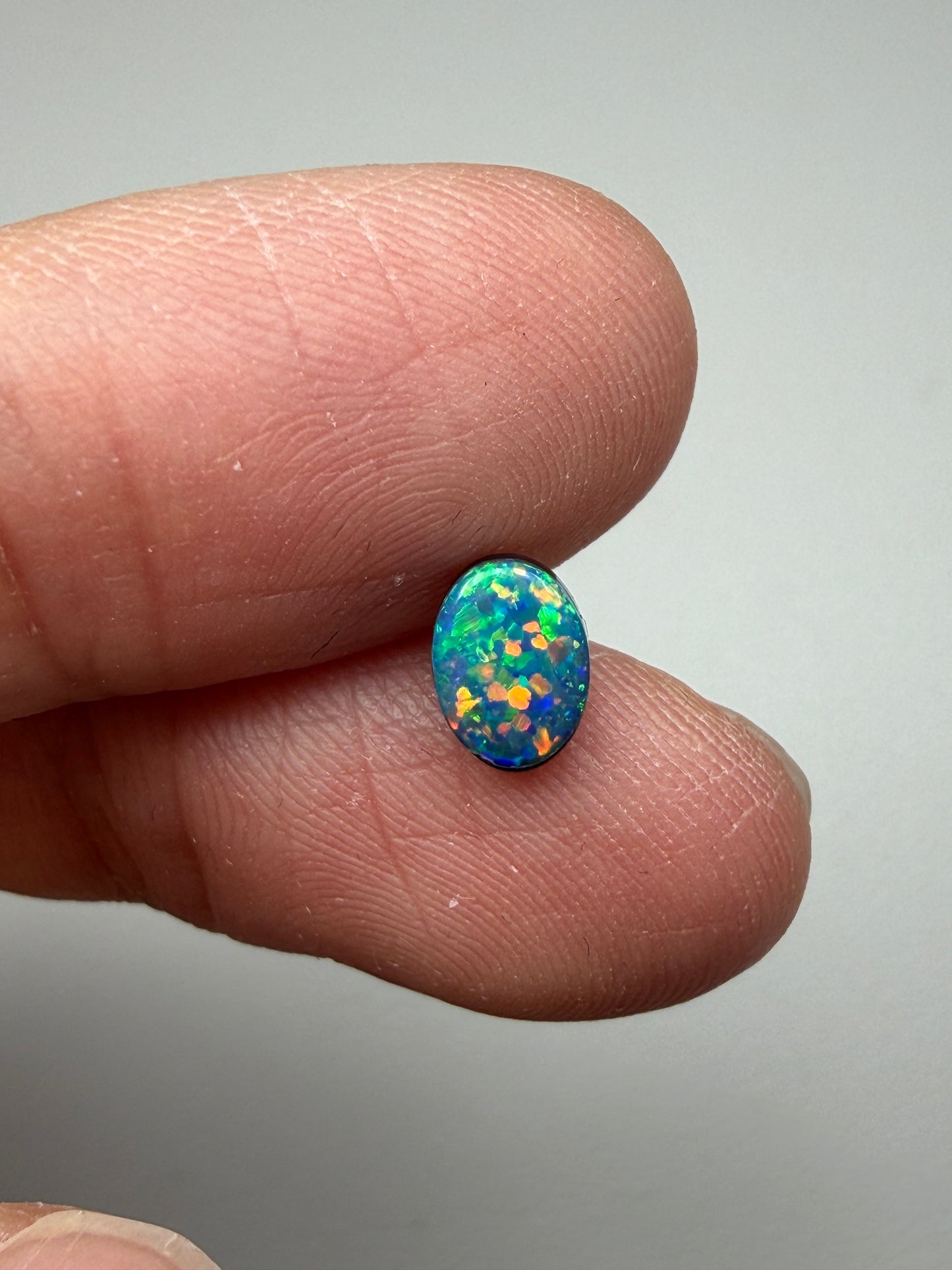 Glitter Glow. Lightning Ridge Doublet Black Opal. 0.54 Ct