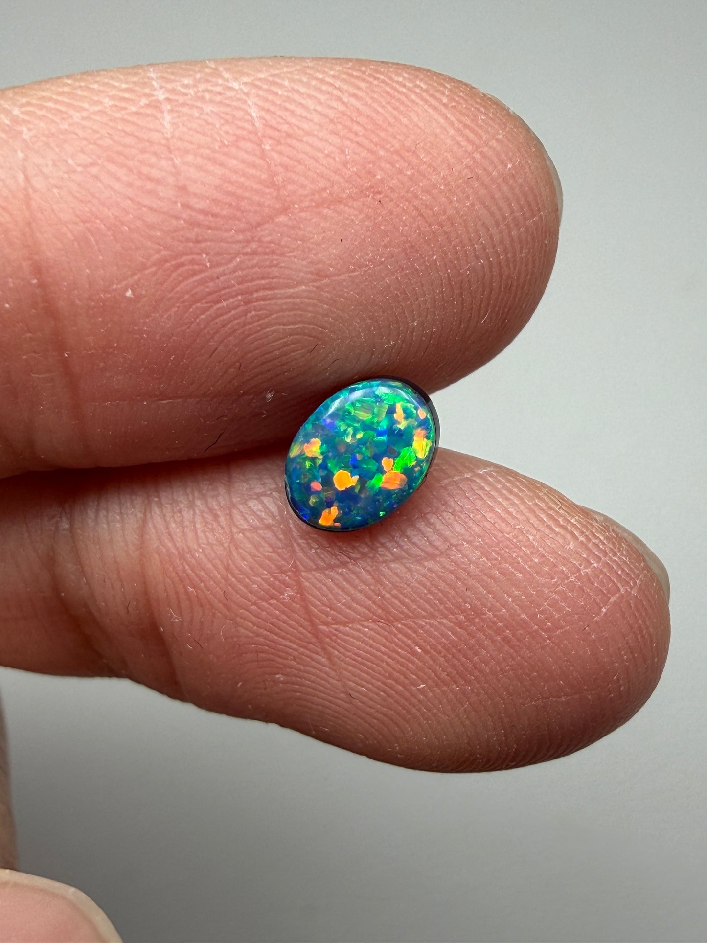 Glitter Glow. Lightning Ridge Doublet Black Opal. 0.54 Ct