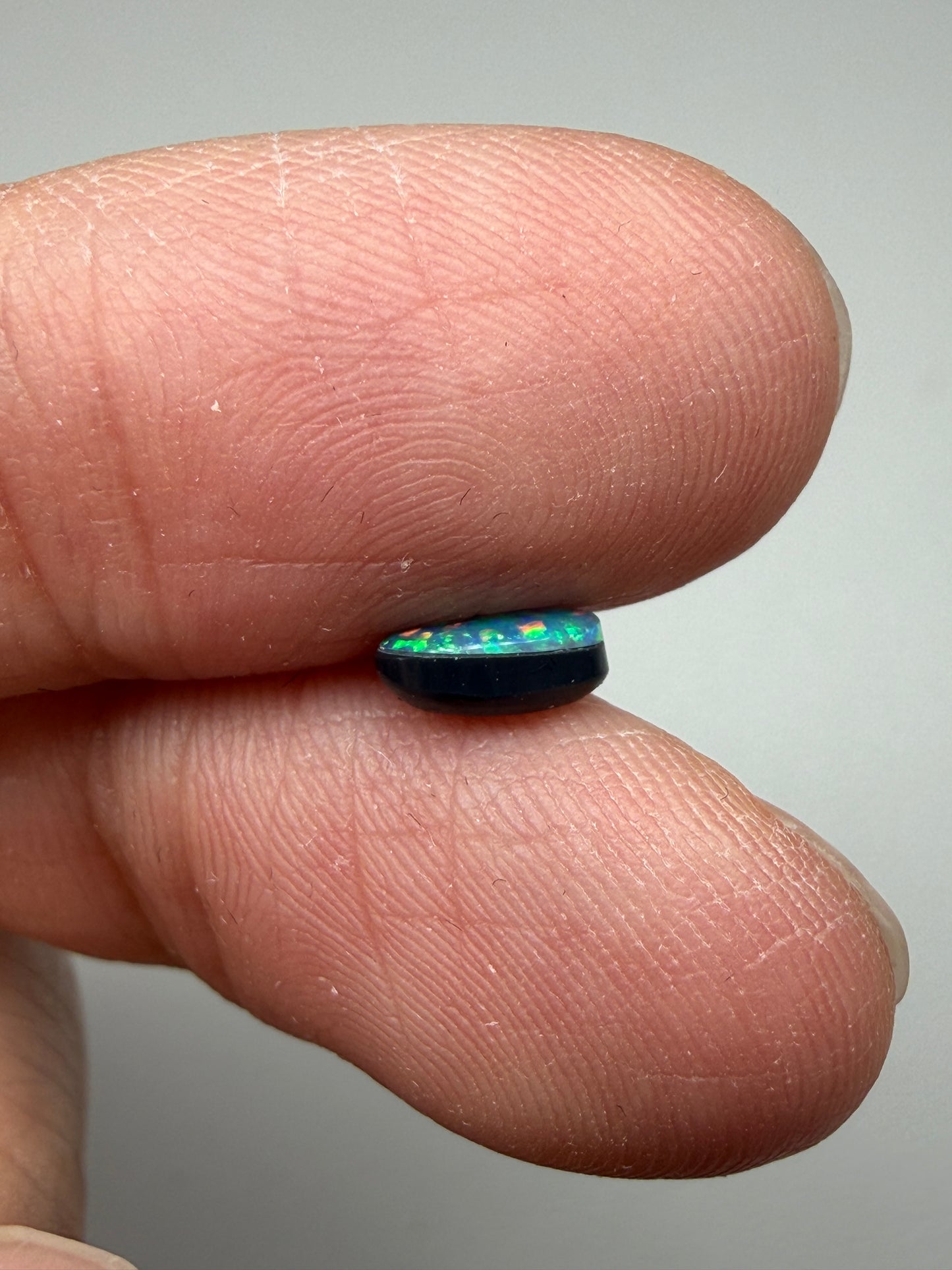 Glitter Glow. Lightning Ridge Doublet Black Opal. 0.54 Ct