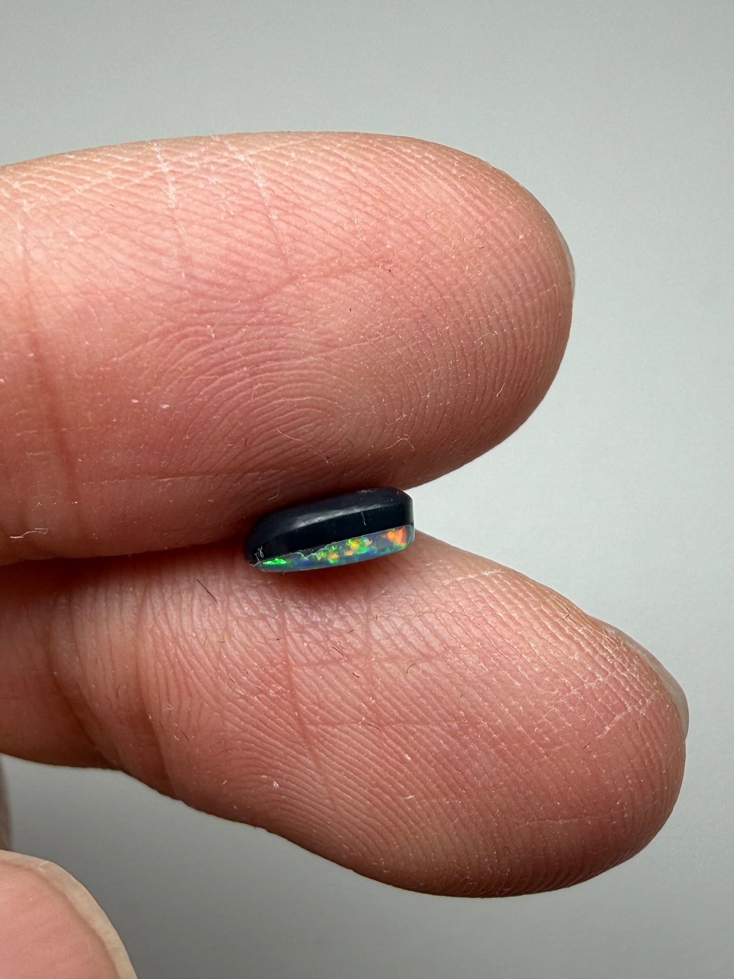 Glitter Glow. Lightning Ridge Doublet Black Opal. 0.54 Ct