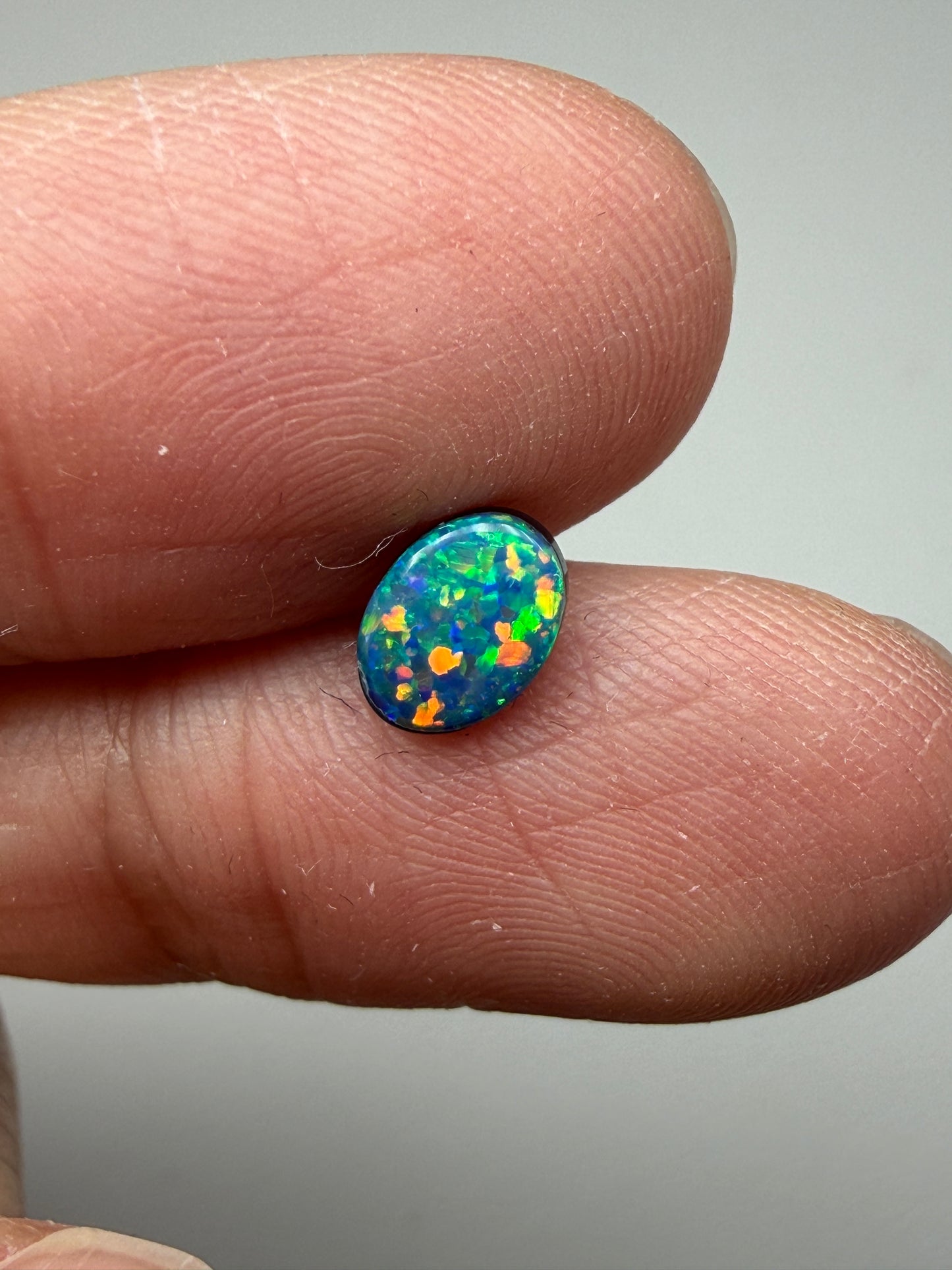 Glitter Glow. Lightning Ridge Doublet Black Opal. 0.54 Ct