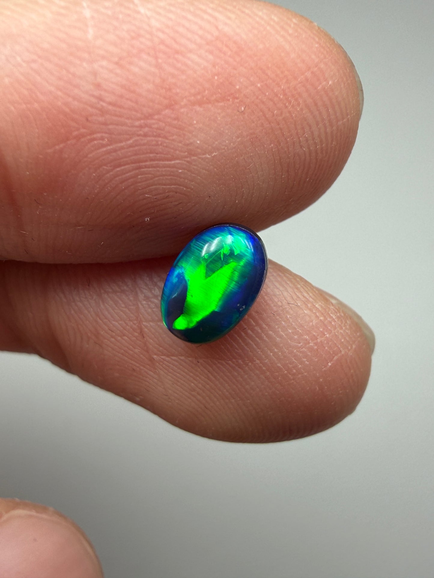 Green Glow. Lightning Ridge Doublet Black Opal. 0.80 Ct