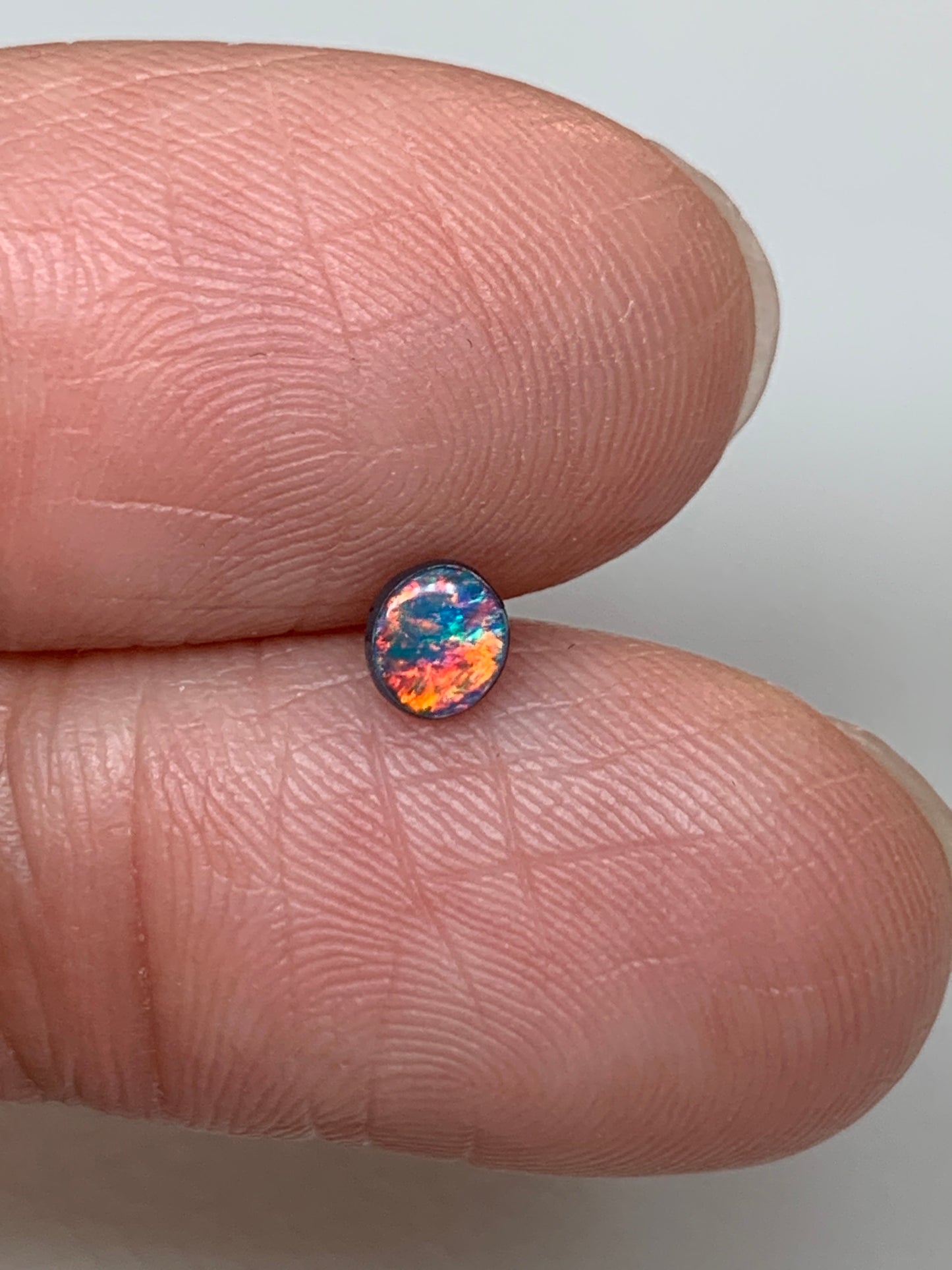 Red Head Cutie. Lightning Ridge Doublet Black Opal. 0.19 Ct