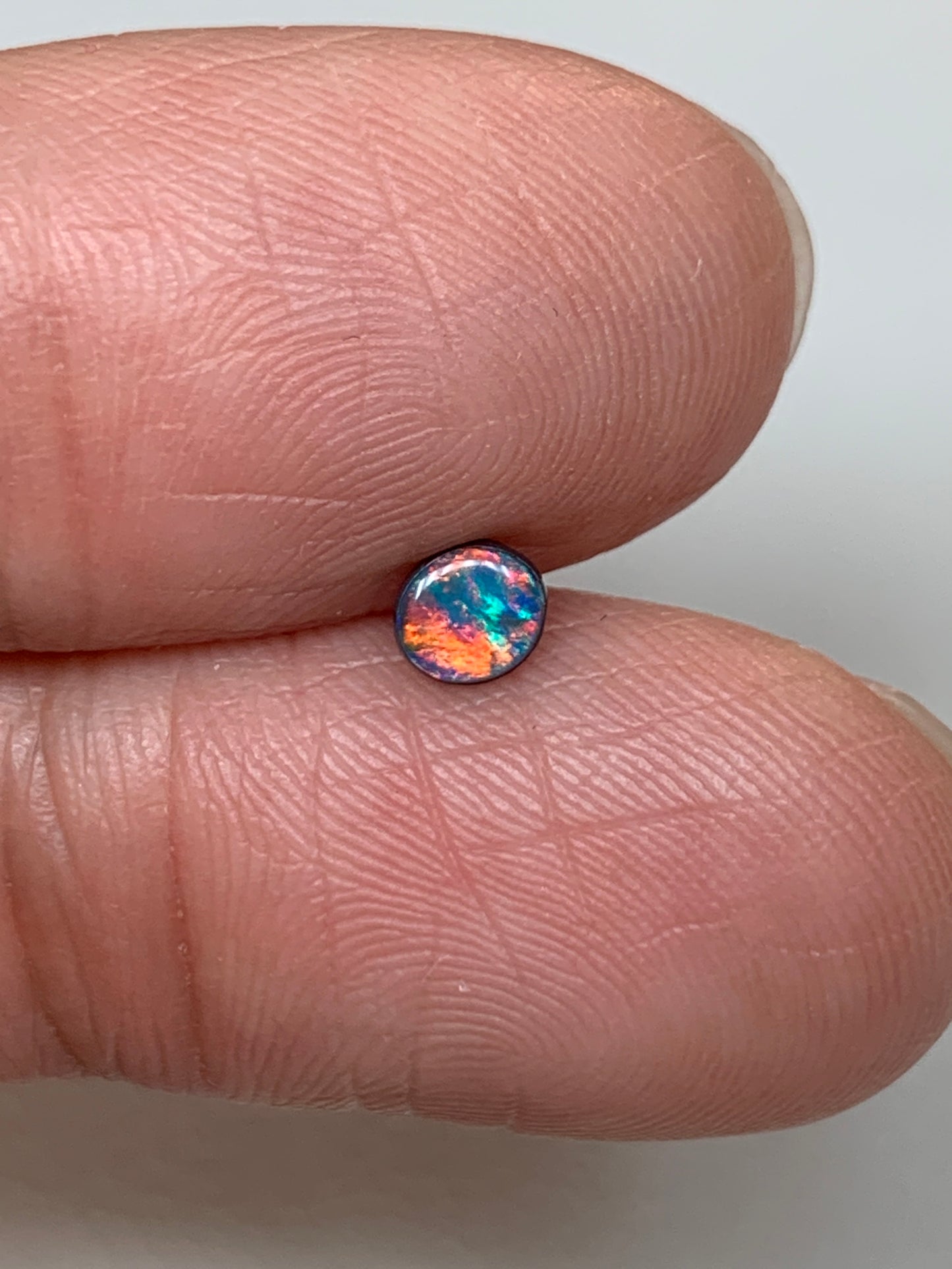 Red Head Cutie. Lightning Ridge Doublet Black Opal. 0.19 Ct