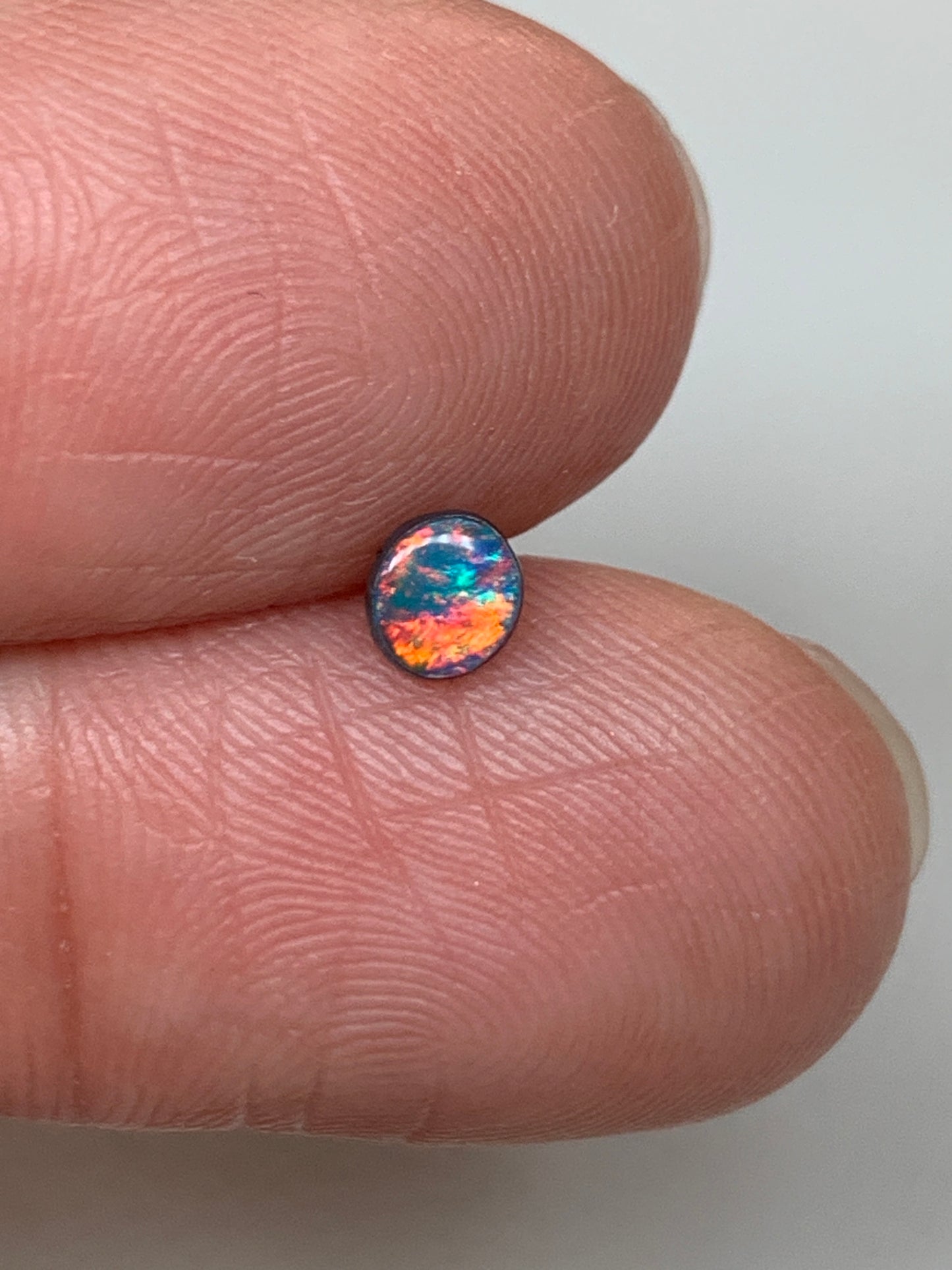 Red Head Cutie. Lightning Ridge Doublet Black Opal. 0.19 Ct