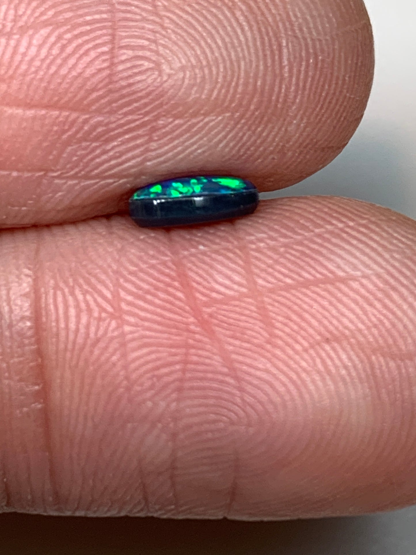 Green Sparkles. Lightning Ridge Doublet Black Opal. 0.31 Ct